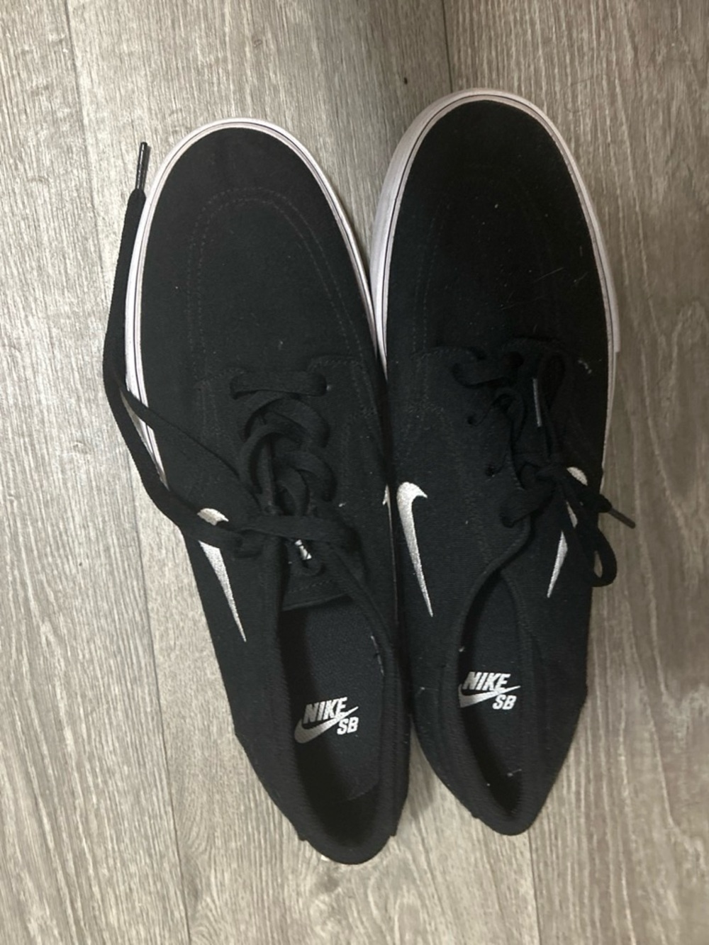 Nike Men’s Black Skate Sneakers with White Swoosh Accent